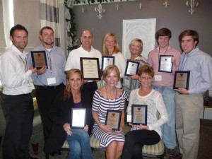 LTA Award Winners (left to right seated) Angel Ellis, GBRCTA Community Coordinator; Yvette Marshall, GBRCTA Secretary; Marty Engle, GBRCTA League Administrator; Kyle Savant and Robby Economides, tournament directors, Crawfish Classic; Rusty Jabour, GBRCTA President, Jennifer Edmonson and Kay Willson, GBRCTA board members; and Dillon and Alex Braud, LSU Tennis Club.